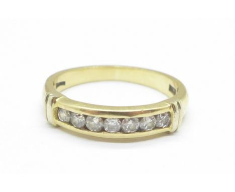 An 18ct gold, seven stone diamond ring, 4.4g, Q 