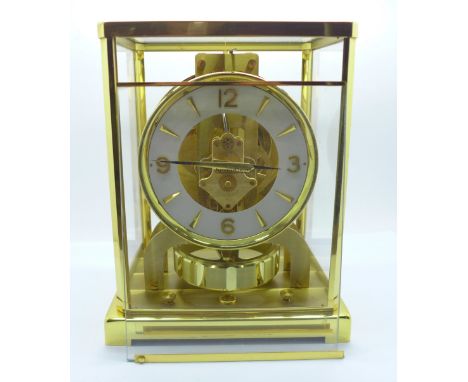 A Jaeger-LeCoultre Atmos clock, front glass requires re-fitting 