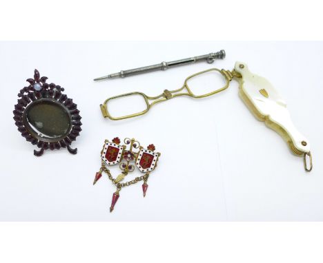 A pair of mother of pearl lorgnettes, a silver retractable pencil with hardstone end cap, an enamel brooch and a miniature st