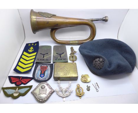 Military badges, a WWI trench art brass box, a RAF beret and a bugle with Argyle and Sutherland badge 