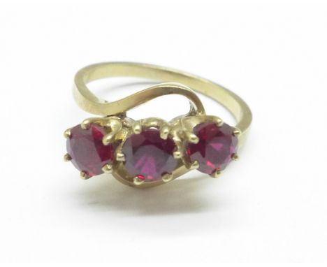 A 9ct gold and three red stone ring, 3.8g, P 