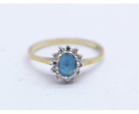 A 9ct gold, blue stone and diamond cluster ring, 1.8g, M 