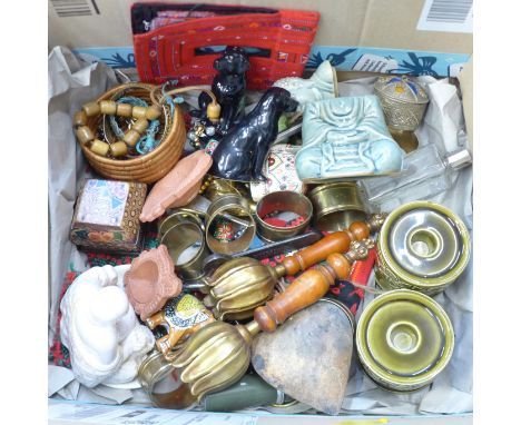 A box of assorted items including two Deity figures, a pair of novelty black labrador salt and pepper pots, a pair of Beswick