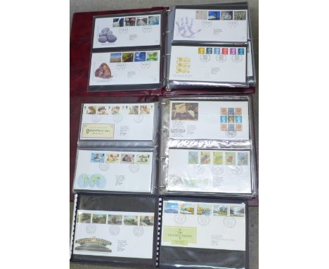 Four albums of first day covers, circa year 2000 