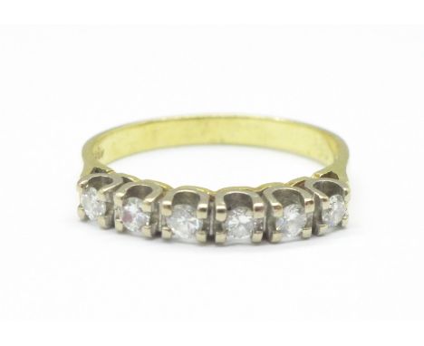 An 18ct gold, six stone diamond ring, 3g, M 