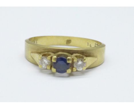 An 18ct gold, three stone diamond and sapphire ring, 3.9g, N 