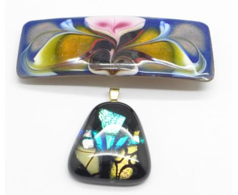 A glass pendant and an enamel clip 