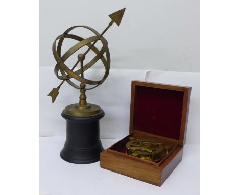 A reproduction brass compass, boxed and an armillary 