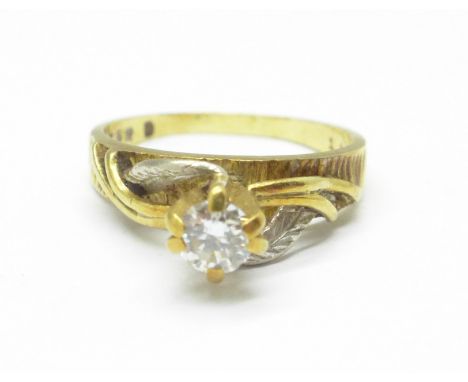 An 18ct gold and diamond solitaire ring, 4.6g, N, over 0.25carat diamond weight, (small chip to the edge of the diamond) 