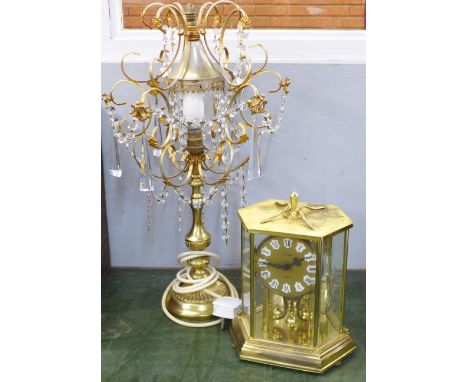 A Kundo clock and a table lamp with crystal drops 