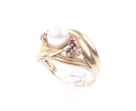 A vintage Continental cultured-pearl and gem set dress ring. The head centred with a 6.8mm diameter three-quarter pearl, rub-