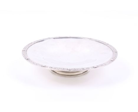 A silver tazza or cake stand on foot. With a Celtic knot and bosse border, marked beneath 'Tarratt Leicester', hallmarks for 