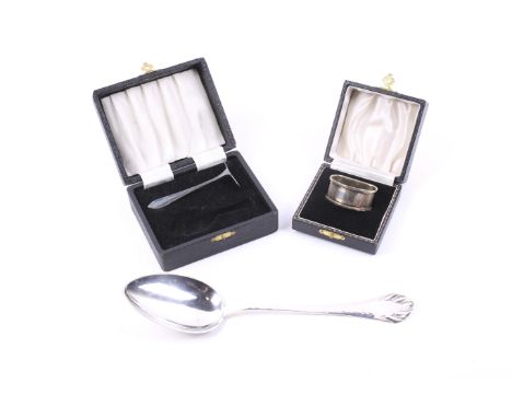 A Danish silver serving spoon and other items. The serving spoon with a hammered tapering handle with a shaped terminal, assa