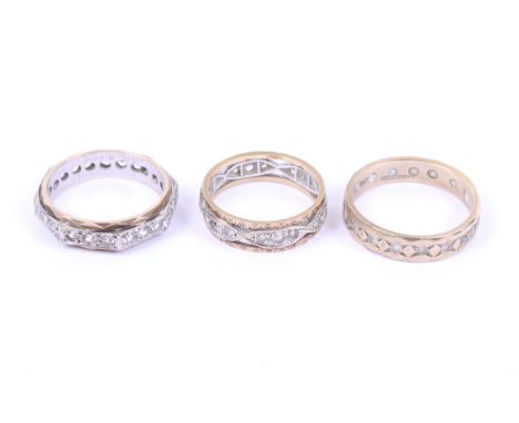 Three vintage 9ct gold and near-colourless paste eternity rings. One in plain gold with a central band of alternate pastes an