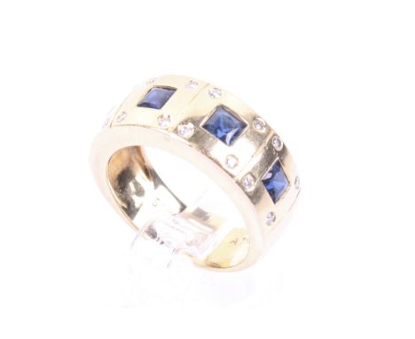A vintage sapphire and diamond broad band ring. Flush-set with four square sapphires with similarly set tiny round brilliant 
