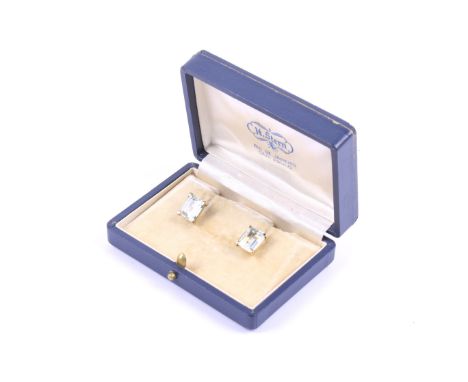 A pair of vintage Continental aquamarine single stone stud earrings. The rectangular step-cut pale blue aquamarines each in a