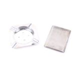 A silver cigarette case and square ash tray.