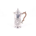 A silver straight sided coffee pot.