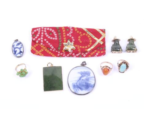 A small collection of Oriental jewellery including two gilt-metal mounted nephrite jade buddha pendants. Each approx. 3.5cm h