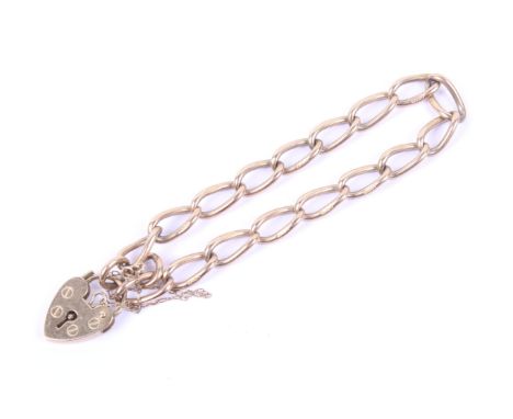 A vintage 9ct gold curb link bracelet. On a padlock clasp with hallmarks for London 1979, approx. 17.5cm long, (7 inches), 12