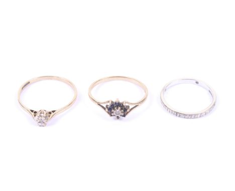 Three 9ct gold and diamond set rings. Comprising; a white gold and tint diamond four stone illusion band ring, engraved insid