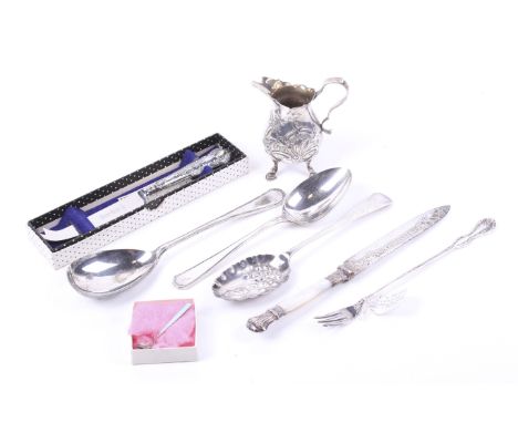 A small collection of silver and plated items. Including a silver baluster cream jug, with embossed flowers, leaves scrolls, 