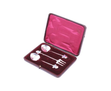 Daniel George Collins, two Art Nouveau silver and enamel spoons and a barbed fork. Each with a reeded handle with an enamelle