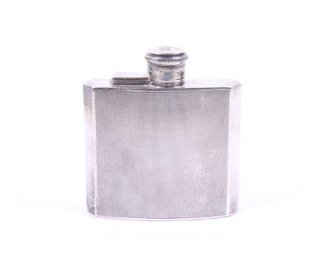An Art Deco silver spirit or hip flask. Marked Henry Clifford Davis, Birmingham 1936, having bevelled edges and engine turned