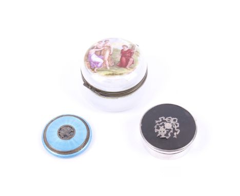 Three round boxes including a Continental silver and blue guilloche enamelled round compact. The hinged lid pierced with a ma