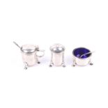 A E Jones, a silver three piece cruet set.