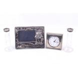 A group of silver mounted items including a silver 'fishing' photograph frame.