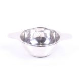 Liberty & Co Ltd. a planished-silver round bowl with two flat handles.