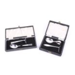 Two silver christening spoon and pusher sets.