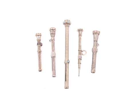 Two Victorian gold and three gold-plated propelling pencils. Comprising; an engine turned cylindrical example with a cabochon