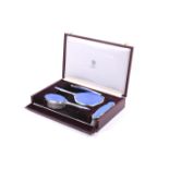 Asprey, a vintage silver and blue guilloche enamelled four piece dressing table set.