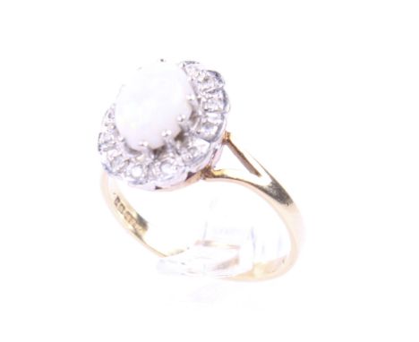 A vintage 18ct gold, opal and diamond oval cluster ring. The central oval cabochon white opal claw set in white within a smal
