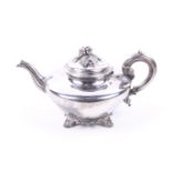 A William IV silver compressed round tea pot.