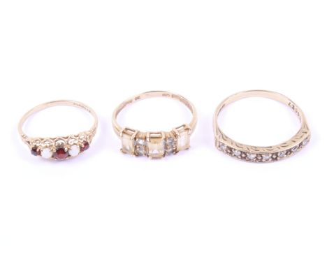 Three vintage 9ct gold and gem set dress rings. Comprising a small eight-cut diamond seven stone half-eternity ring, hallmark