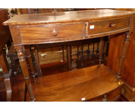 A 19th century mahogany bowfront two-drawer side table, on ring turned supports, width 100cm