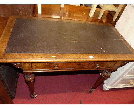 A mid-Victorian figured walnut and rexine inset round cornered single drawer writing table, on turned and fluted supports, wi