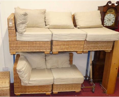 A contemporary wicker conservatory corner sofa, with fabric scatter cushions, and a matching square hinge topped chest 