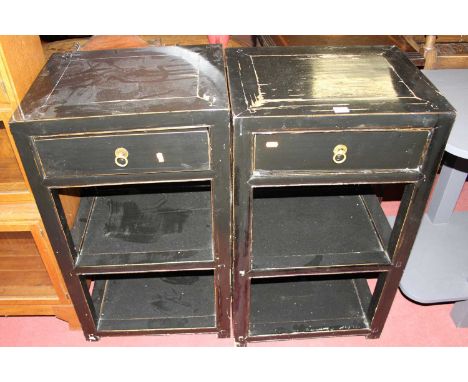 A pair of contemporary Oriental black painted three-tier lamp tables, each with single upper drawer, w.49.5cm