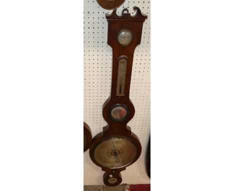 An early 19th century mahogany four-dial wheel barometer, with lower signed scales