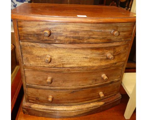 A hardwood bowfront table top chest of four long graduated drawers, width 53.5cm