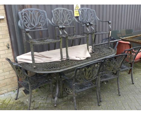 A contemporary pierced cast metal garden suite, comprising; long D-end table, length 210cm, a set of eight matching scroll el
