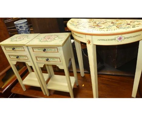 A contemporary floral painted demi-lune side table, together with a pair of floral painted two-drawer two-tier bedside tables