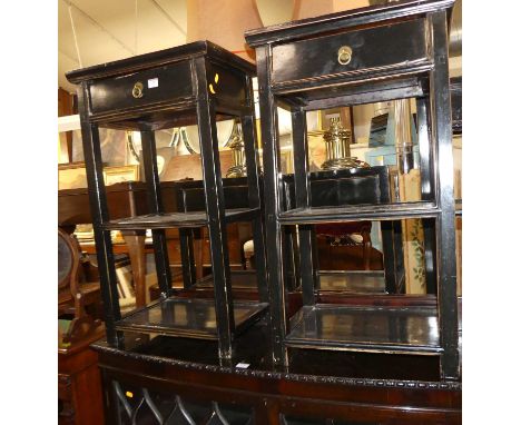 A pair of contemporary Oriental black painted three-tier lamp tables, each with single frieze drawer, w.47.5cm