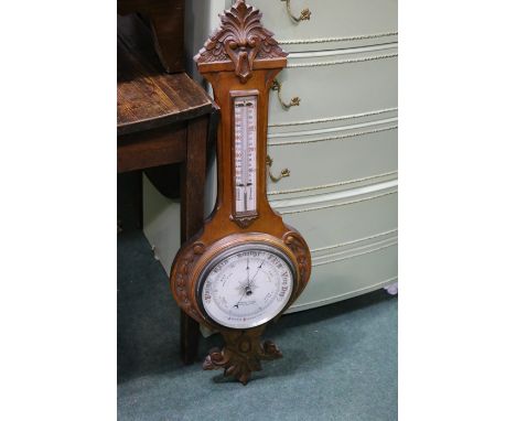 Barometer/ thermometer by S. Maw Son &amp; Sons Aldersgate Street London, housed in a scroll and acanthus leaf carved oak fra