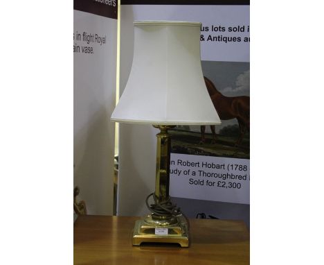 Brass reading lamp with hexagonal shade, on a stepped square base