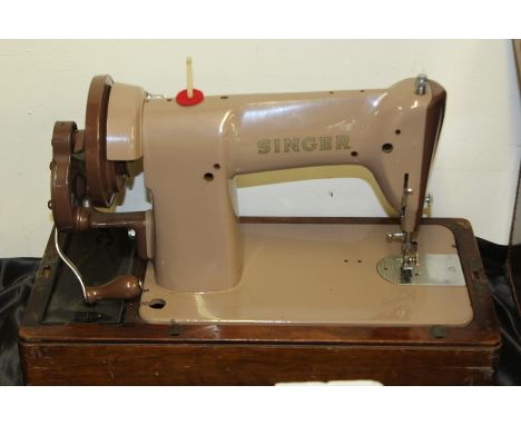 Singer manual sewing machine, housed in a domed case